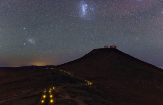 The Large Magellanic Cloud (middle left) and Small Magellanic Cloud (upper center) over Paranal Observatory in Chile. European Southern Observatory