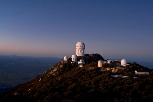 Kitt Peak National Observatory mountain top at Dusk looking north. Visible in the picture are the NOAO 4-meter Mayall, the Steward Observatory 90-inch, the University of Arizona Lunar and Planetary Laboratory Spacewatch Telescopes, LOTIS, 0.4-meter Visitor Center Telescope, Case Western Reserve University Observatory and the SARA Observatory. Credit: P. Marenfeld (NOAO/AURA/NSF)