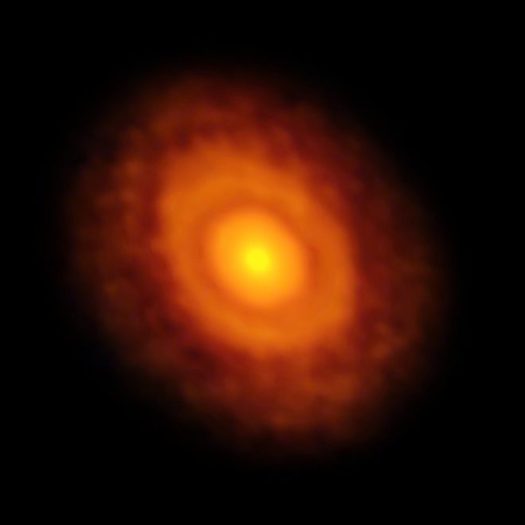 This image of the planet-forming disc around the young star V883 Orionis was obtained by ALMA in long-baseline mode. This star is currently in outburst, which has pushed the water snow line further from the star and allowed it to be detected for the first time. The dark ring midway through the disc is the water snowline, the point from the star where the temperature and pressure dip low enough for water ice to form.