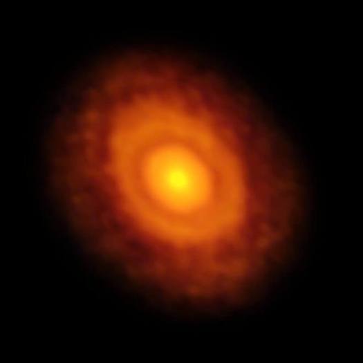 This image of the planet-forming disc around the young star V883 Orionis was obtained by ALMA in long-baseline mode. This star is currently in outburst, which has pushed the water snow line further from the star and allowed it to be detected for the first time. The dark ring midway through the disc is the water snowline, the point from the star where the temperature and pressure dip low enough for water ice to form.